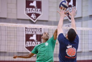 Intense net action in men's volleyball game